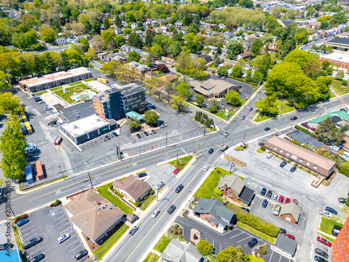 Obraz na plátně Aerial view of a busy city intersection with crosswalks, traffic signals, and urban road infrastructure
