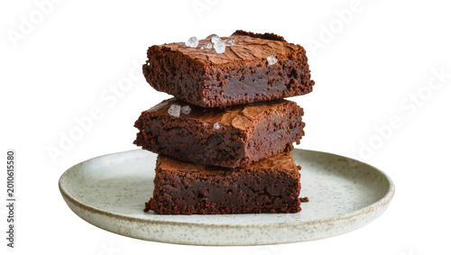 Foto Stack of three rich dark chocolate brownies with flaky sea salt, isolated on tra