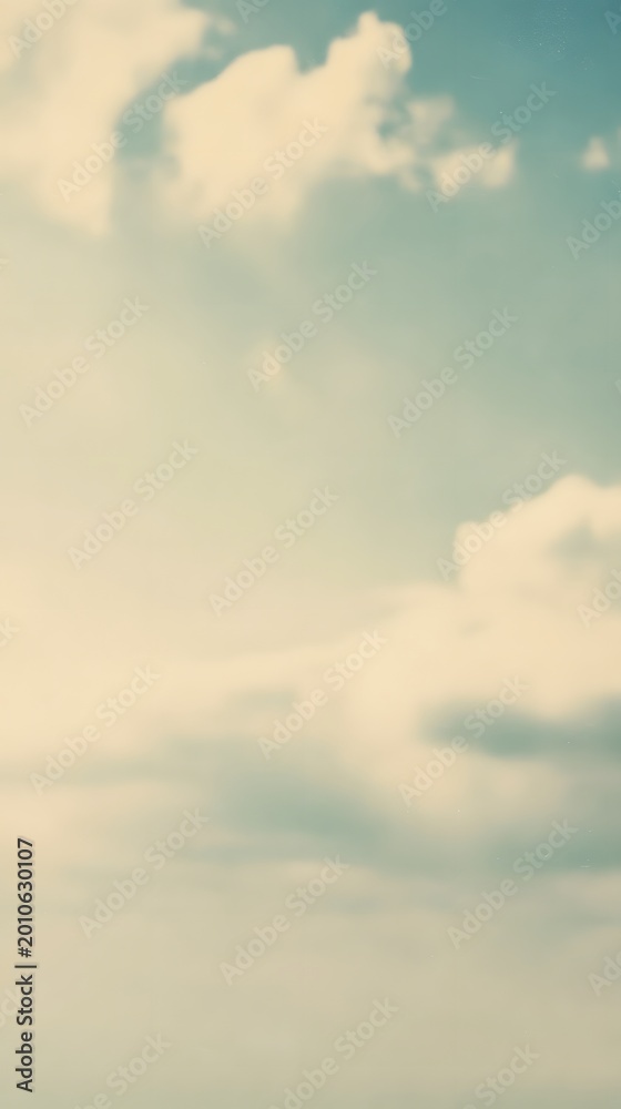 Obraz premium Blue sky with white fluffy clouds. Soft natural background for design and creative projects. Heavenly atmosphere, peaceful daylight scenery with gentle sunlight and clear horizon.