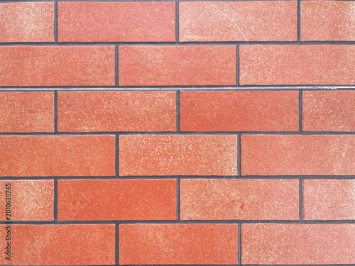 Red brick wall texture background with clean geometric pattern, ideal for construction and urban design concept