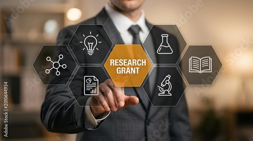 A businessman in a suit presents a research grant idea using floating innovation and science icons, ideal for business, education, and technology marketing campaigns.