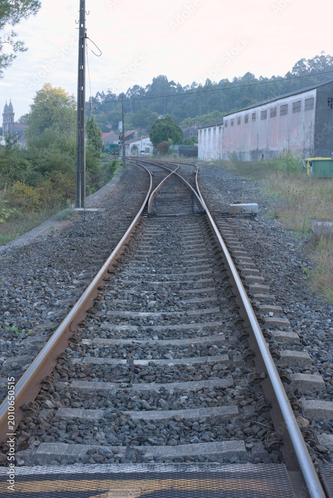 Fototapeta premium Railway Track Switch and the Path Ahead, Padrón, Spain.
