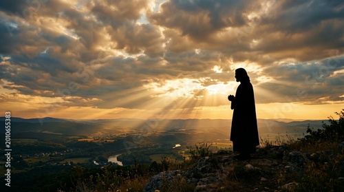 Jesus Silhouette with Light Rays Through Clouds Calm Spiritual Background