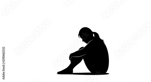Konstfotografi Silhouette of a lonely woman sitting alone in deep sorrow.