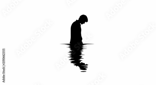 Bild auf Leinwand Silhouette of a sad man standing in deep water reflecting downwards