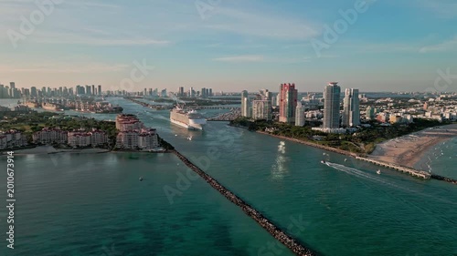 Aerial view Cruise ship sailing next to Miami South Beach. . cruise ship sailing near South Beach. Cruise liner sailing from Miami harbor. Cruise vacation