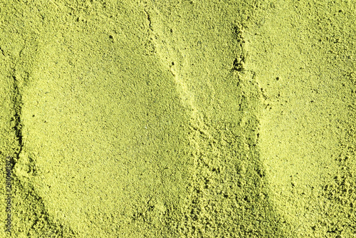 textured surface of green matcha powder  natural background perfect for health, food, or branding visuals