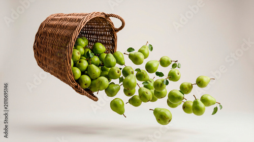 Green pears spilling out of wicker basket, fresh fruit flying in air, isolated on light background