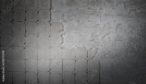 Gray distressed concrete wall texture with old tile pattern, industrial grunge background