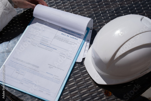 Cuadro en lienzo A tablet with documents or bill of lading a protective helmet