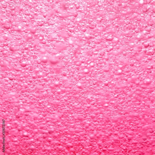 Bubbles Floating in Pink Background During Light Reflection Events