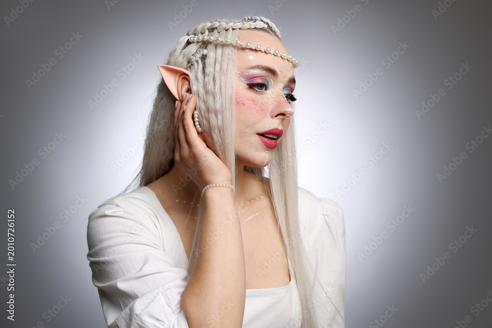 Naklejka premium Beautiful elf girl on grey gradient background