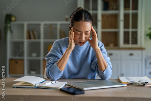 Принти на полотні Stressed woman experiencing headache and burnout from work