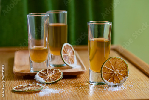 Cocktails in small glasses with lime and salt