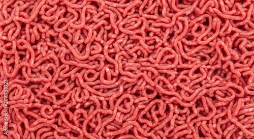 Close up texture of fresh raw minced beef meat showing intricate red patterns.