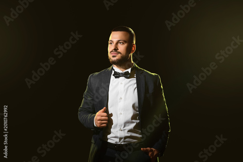 Handsome man in stylish sui...