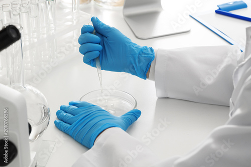 Female scientist dropping w...