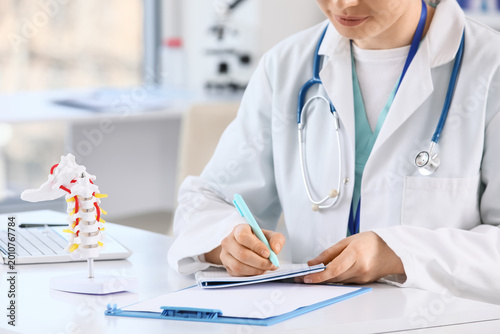 Female doctor with spine mo...