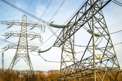 Φωτογραφία High voltage power lines connecting to electricity generating substation (out of