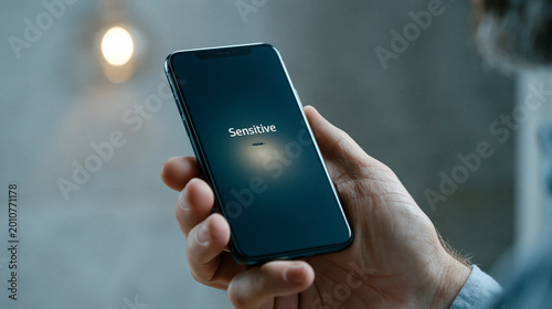 Smartphone in Hand: A close...