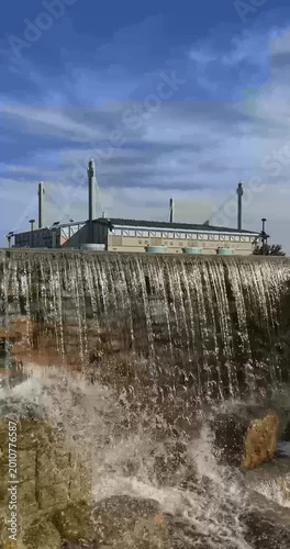 San Antonio, Texas, USA - December 2, 2025:  Exterior vertical video of the San Antonio Alamodome, a multi-purpose stadium, with water feature in the foreground.