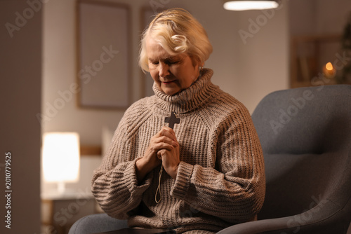 Christian senior woman with...