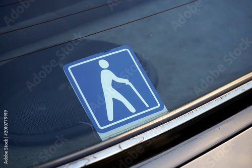 Senior driver car sticker with international elderly person icon with white cane on blue background