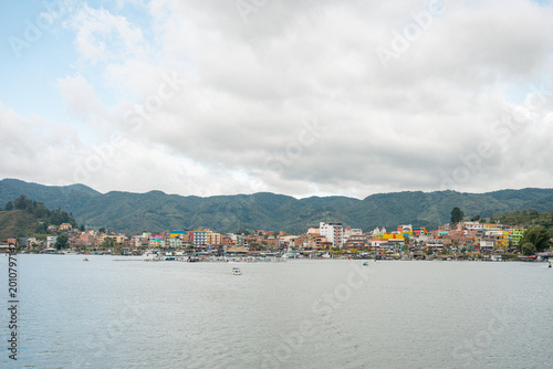 Guatape village houses lining lake shore