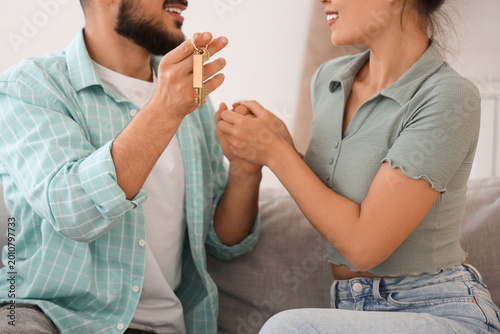 Young couple with key from ...