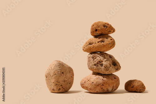 Many sea stones on beige ba...