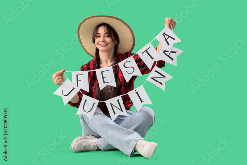 Young happy woman in straw ...