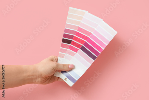 Female hand with pink color...
