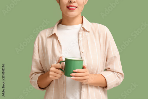 Young Asian woman with cup ...