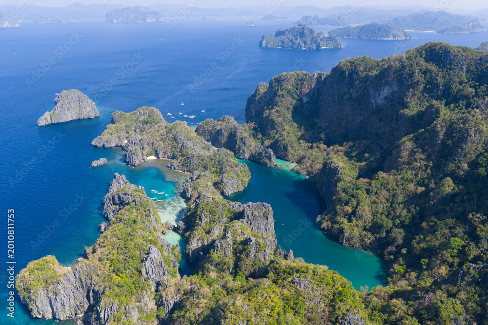 Fototapeta premium Big Lagoon is found amid the scenic limestone islands of El Nido. This area in the Philippines is a popular vacation destination due to its beautiful coral reefs, beaches, and hidden lagoons.