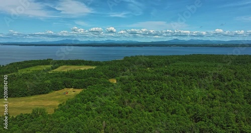 Willsboro, NY, USA  July 22, 2025  Aerial timelapse video over Willsboro Point, in Town of Willsboro NY  and Lake Champlain at the foot of New York's Adirondack Mountains.