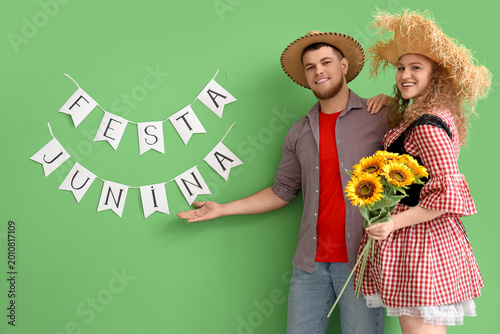 Happy young couple with sun...