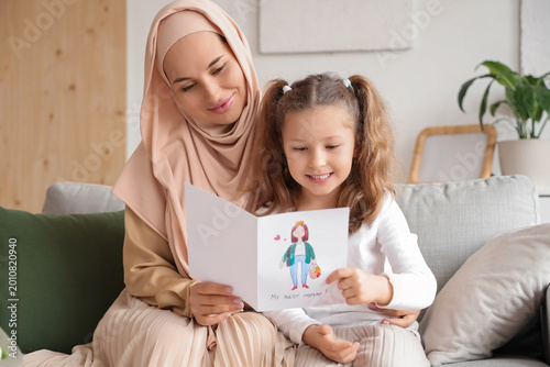 Little girl with greeting c...
