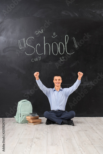 Cheerful male student with ...