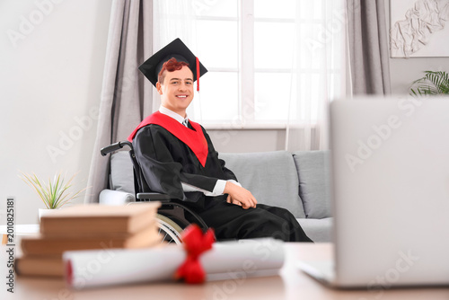 Male graduate in wheelchair...