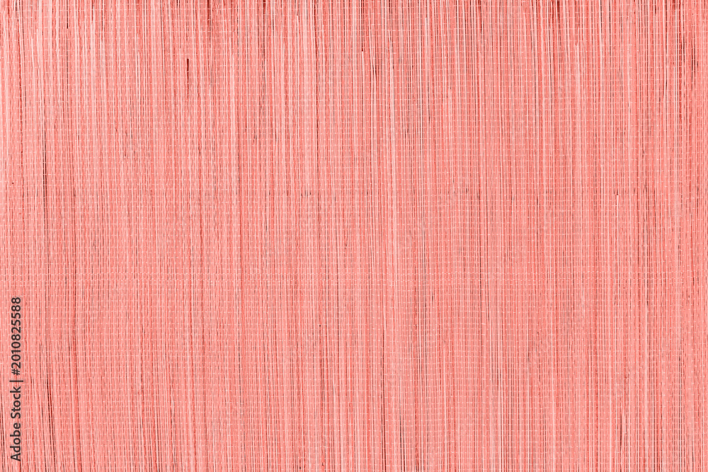 Fototapeta premium Surface texture showing vertical lines and patterns in light pink color during daylight