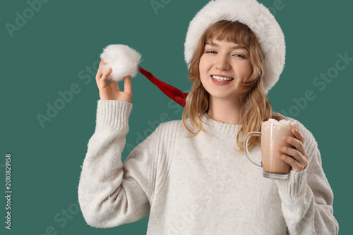 Pretty young woman in Santa...