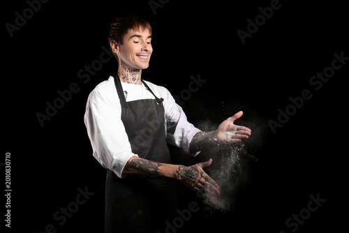 Tattooed happy male chef cl...