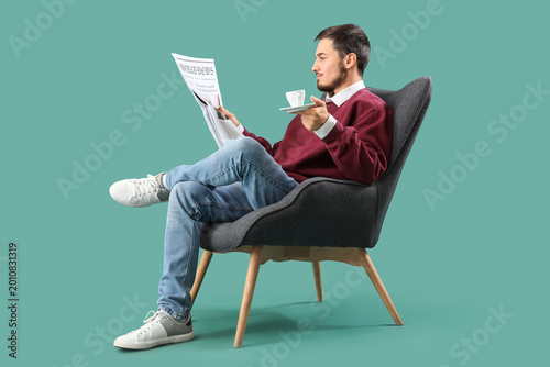 Young man with coffee cup r...