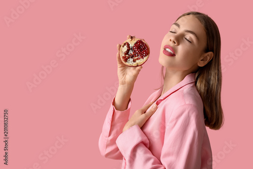 Young woman with pomegranat...