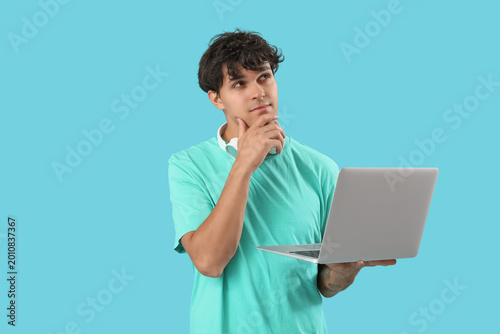 Thoughtful male programmer ...