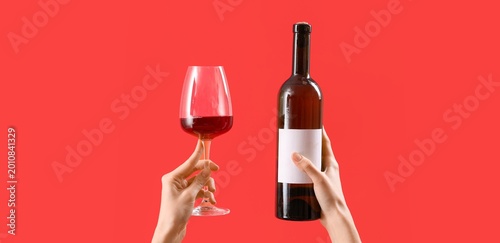Hands with bottle and glass...