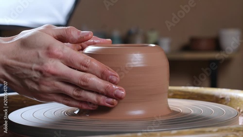 Hands Shaping Clay on Pottery Wheel Crafting Artisan Ceramics