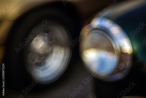 Close-up view vintage auto details with bubble bokeh effect.
