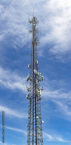 Картината върху платно High-resolution vertical panorama of a telecommunications cell tower against a b