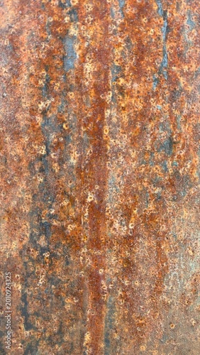 Macro Texture of Heavily Corroded Rust on Metal Surface, Orange-Brown Oxidation Patterns with Blue-Grey Underlayers